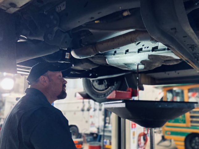 Mechanic changing oil